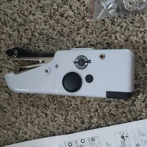 Battery operated mini handheld sewing machine